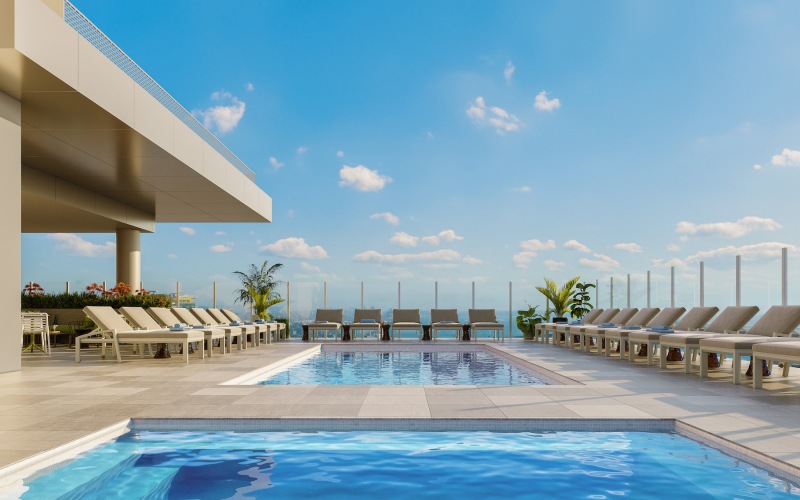 Swimming pool with lounge seating on the rooftop