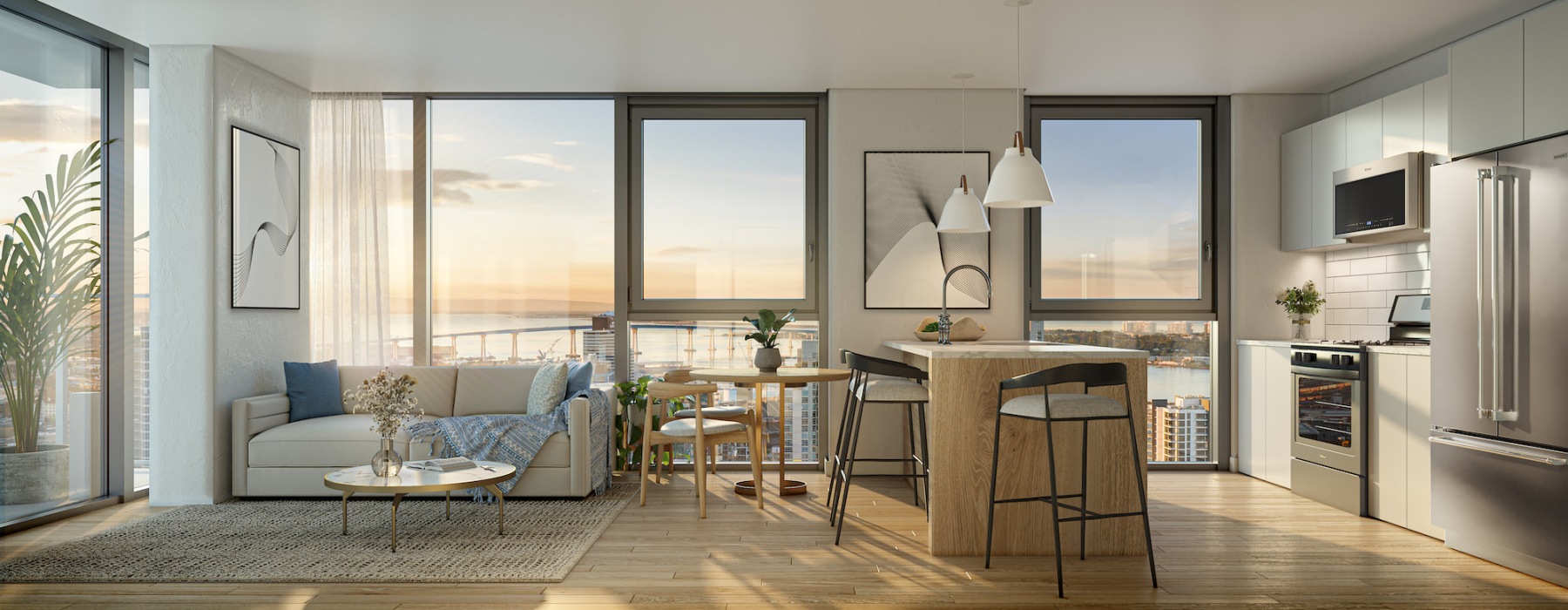 Living area and kitchen with large windows