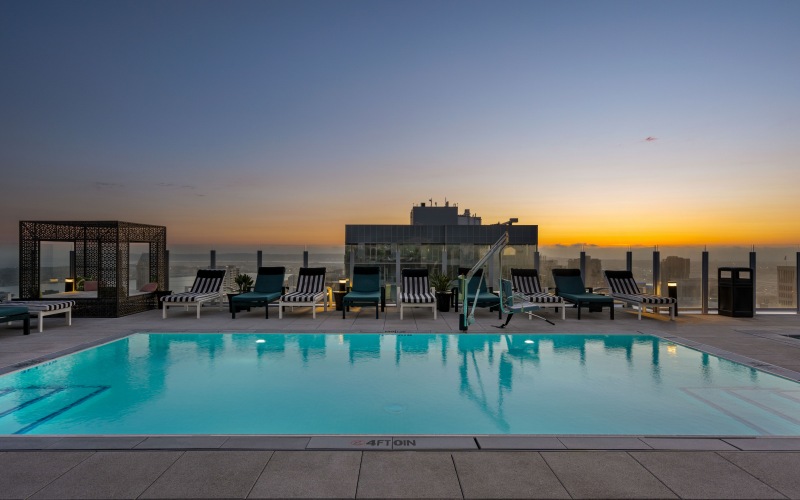 Swimming pool with lounge seating on the rooftop